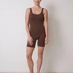 Flattering bra-free bodysuit with stretchy, moisture-wicking fabric, no front seam to prevent camel toe, perfect for Pilates
