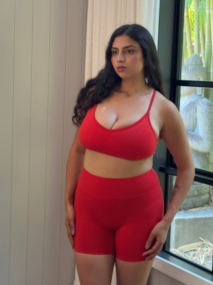 Woman with a fuller bust wearing a supportive merino sports bra