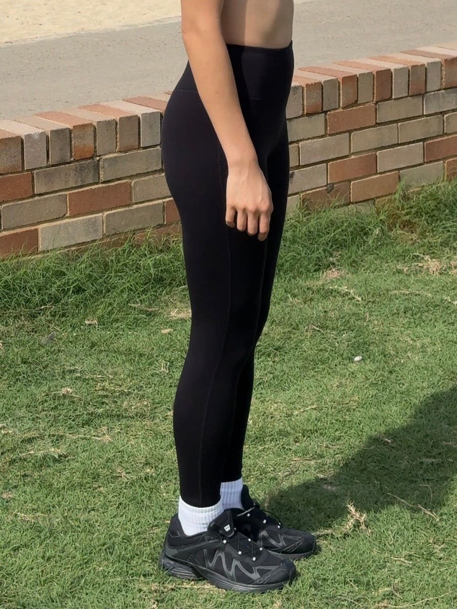 Full-length merino leggings shown from waist to ankle to illustrate leg length on a smaller frame