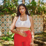 size-12-model-in-nature-wearing-estroni-merino-vanilla-white-racerback-sports-bra-and-estroni-merino-scarlet-red-shorts-5"