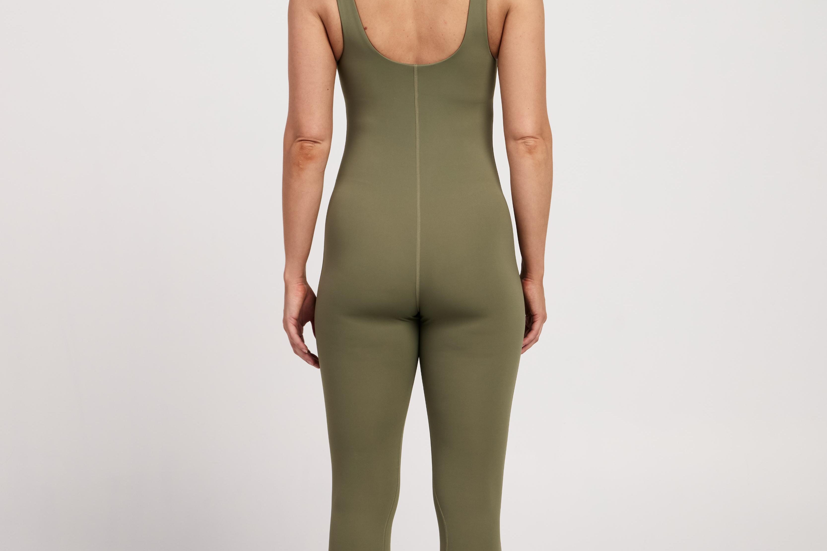 Stretchy sleeveless bodysuit with built-in bra, offering full-length coverage and breathable fabric for Pilates comfort