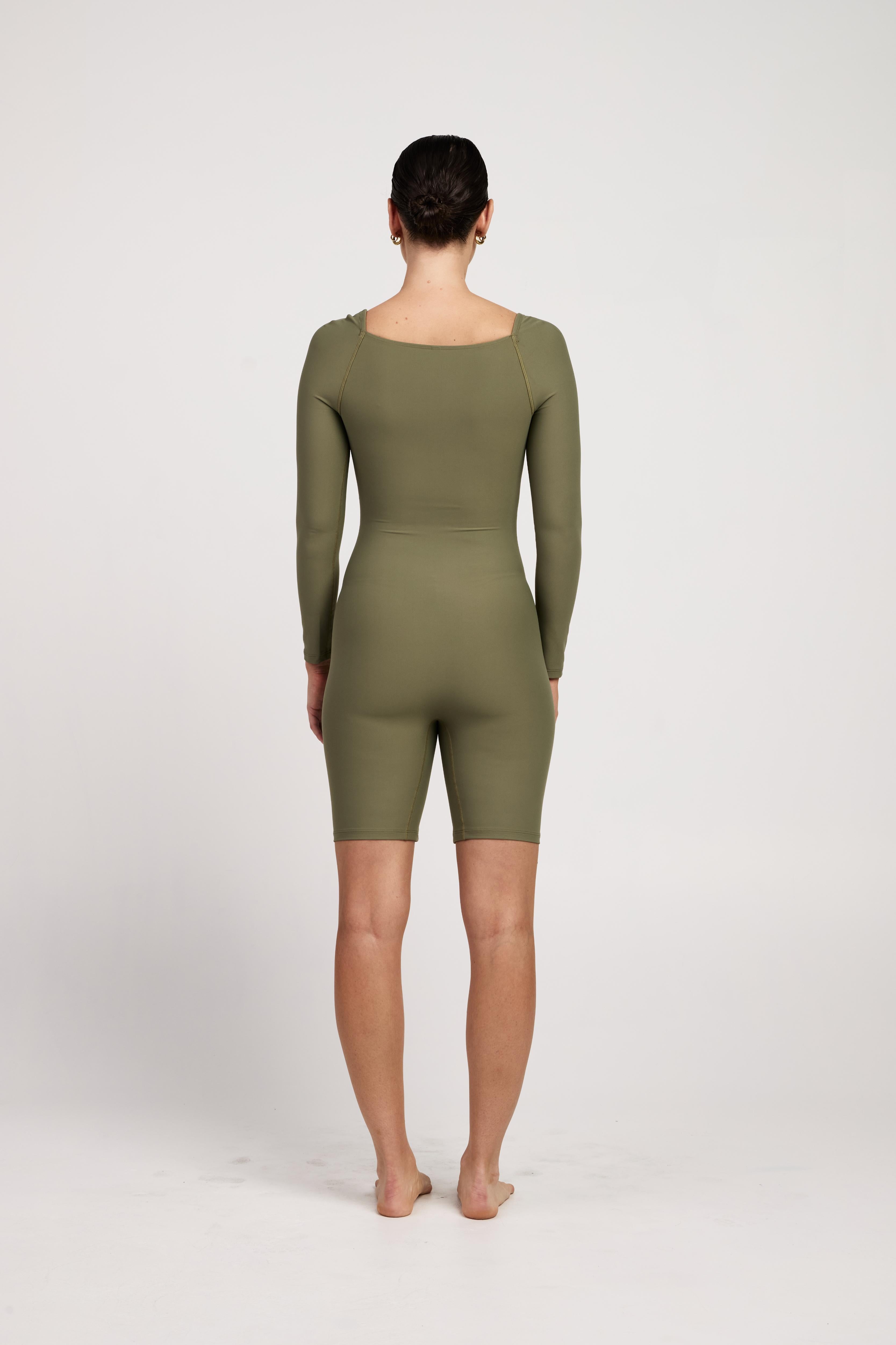 Women's long-sleeve bra-free bodysuit with short legs, featuring super stretchy, moisture-wicking fabric, ideal for yoga, Pilates, or pregnancy.