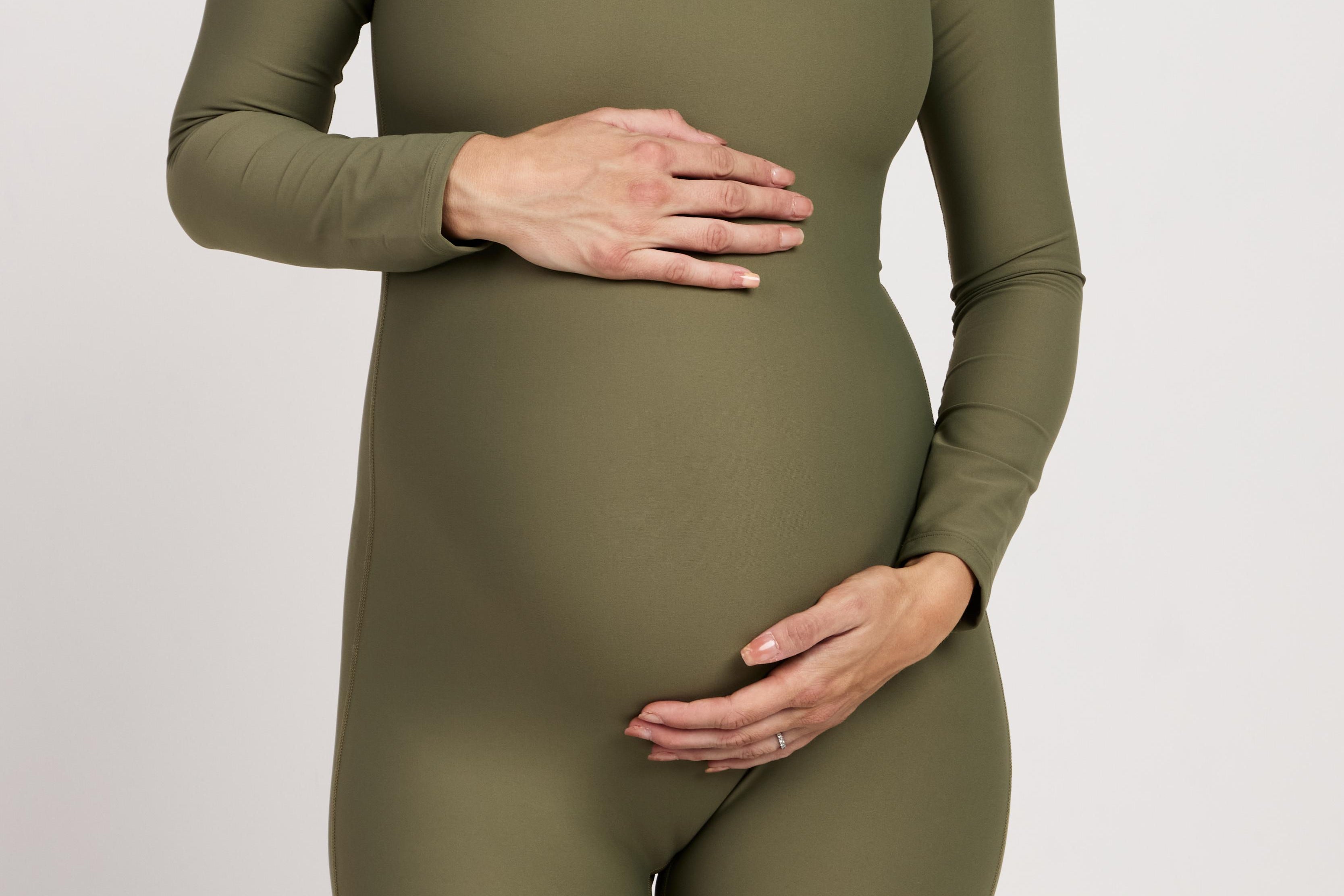 Bra-free long-sleeve maternity bodysuit with short legs, made from breathable, moisture-wicking fabric, perfect for Pilates, yoga, or casual maternity wear