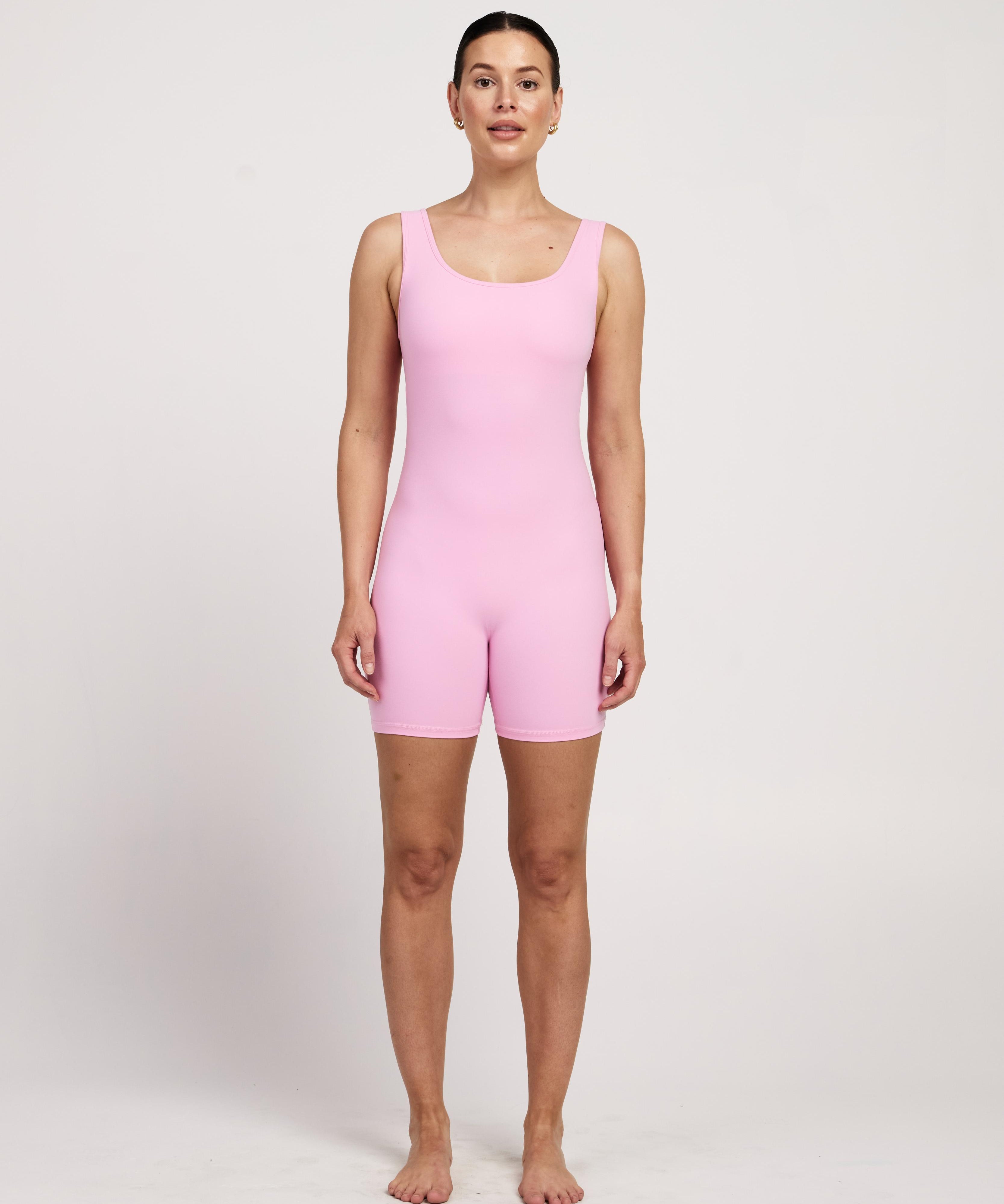 Women's pink sleeveless bodysuit with in-built bra, perfect for yoga, Pilates, or maternity wear, 5-inch leg length