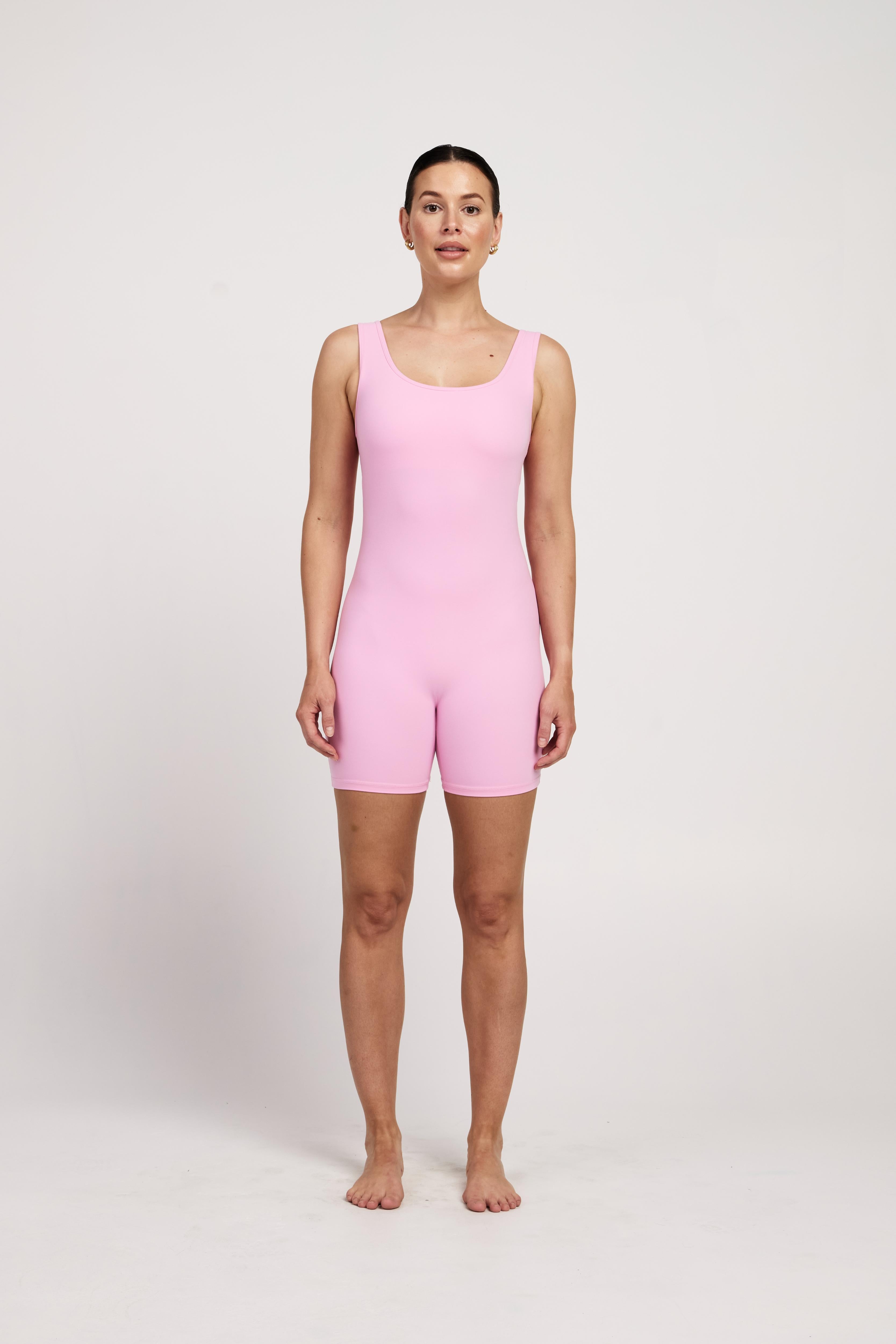 Women's pink sleeveless bodysuit with in-built bra, perfect for yoga, Pilates, or maternity wear, 5-inch leg length