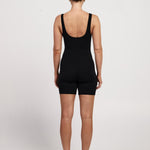 Bra-free activewear bodysuit with 6-inch shorts, stretchy fabric, moisture-wicking design, and a classic fit, suitable for Pilates