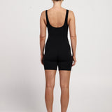 Bra-free activewear bodysuit with 6-inch shorts, stretchy fabric, moisture-wicking design, and a classic fit, suitable for Pilates