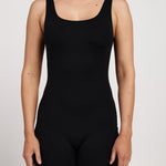 Women's bra-free bodysuit with 6-inch short legs, stretchy and moisture-wicking fabric, offering a classic fit for Pilates comfort